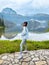 woman enjoying beauty of nature looking at mountain lake in Montenegro