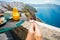 Woman enjoying breakfast in beautiful Santorini