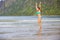 Woman, enjoying Ersfjord Beach on Senja island, beautiful landscape view over the mountains