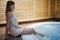 Woman enjoying jacuzzi at spa resort