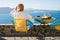 Woman enjoying morning in luxury hotel in Santorini