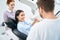 Woman enjoying new removable dental prosthesis sitting in orthodontic chair