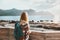 Woman enjoying sea view traveling with backpack