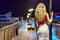 Woman enjoying the summer evening portrait from the back. Port view Protaras, Cyprus. Yacht at the backgroundd