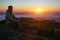 Woman enjoying the sunrise in the mountains