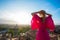 Woman enjoying sunrise overlooking city