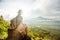 Woman enjoying sunrise from a top of mountain Batur, Bali, Indonesia