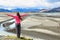 Woman enjoying view of Iceland black sand dunes