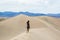 Woman enjoying the view of Mesquite Flat Sand Dunes at Death Valley National Park California