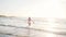 Woman enjoying a walk along the beach