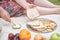 Woman enjoys a healthy breakfast picnic, whole grain bread, crackers, fruits