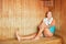 Woman enjoys the heat in the sauna