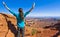 Woman Enjoys Scenic Overlook from Canyonlands\' Island in the Sky
