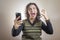 Woman enraged with her phone