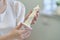 woman entrepreneur holds a ready-made candle made of beeswax in her hands. small business concept