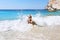 Woman at Erimitis beach Paxos island Greece