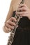 Woman in evening dress playing oboe, detail