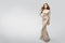 Woman Evening Sparkling Dress, Elegant Fashion Model in beautiful glittering Gown, Beauty Studio Portrait