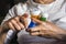 Woman examining medication treatment, several boats in the hand, conceptual image