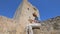 Woman is examining touristique brochure sitting near Kolossi castle in Cyprus