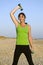 Woman exercising on beach.