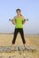 Woman exercising on beach.