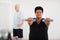 Woman exercising with dumbbells in studio