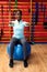 Woman exercising with exercise ball in sports center