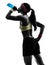 Woman exercising fitness drinking energy drink silhouette