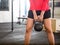 Woman Exercising With Kettlebell In Gym