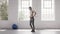 Woman exercising standing Lunges in fitness studio