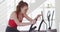 Woman exercising on stationary bike at home