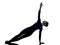 Woman exercising Vasisthasana side plank pose yoga silhouette