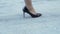 Woman in expensive high heel shoes gracefully rising up stairs, businesswoman