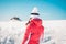 Woman explorer skier looking the snowy horizon