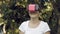 Woman explores virtual reality using VR glasses