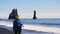 Woman exploring beautiful Reynisfjara beach near Vik, Icealnd