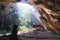 A woman exploring inside Phraya Nakorn cave in  Prachuap Khiri Khan Province, Thailand