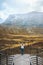 Woman exploring Norway travel outdoor autumn landscape tourist on Vegaskjelet viewpoint aerial view