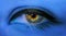 Woman eye close-up macro with long eyelashes and professional blue make-up in blue neon light