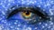 Woman eye close-up macro with long eyelashes and professional blue make-up with stars in blue neon light