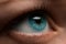 Woman eye with contact lens applying, macro. Blue dilated pupil,