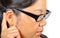 Woman with eyeglasses wearing hearing aid