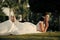 Woman face beauty. Woman lying on green grass on tropical landscape