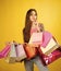 Woman face beauty. Woman shopaholic with paper bags, sale