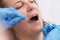 woman face being treated for dental issues with precision and care at dental practitioner& x27;s office