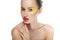 Woman face with bright yellow makeup and manicure