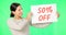Woman, face and discount sign on green screen, smile and advertising with poster, store promotion and sale. Portrait