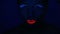 Woman face with fluorescent make up