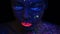 Woman face with fluorescent make up